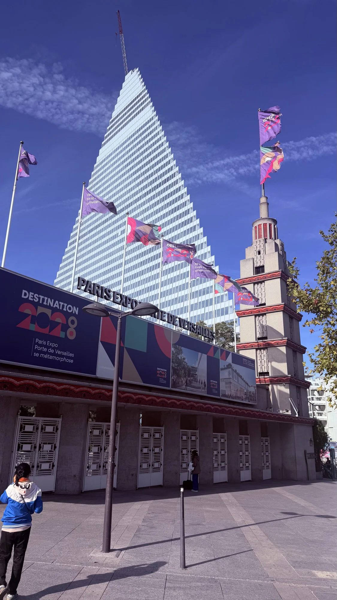 Exterior facade of Paris Expo Porte de Versailles with DESTINATION 2028 lettering, venue of art3f Paris 2026